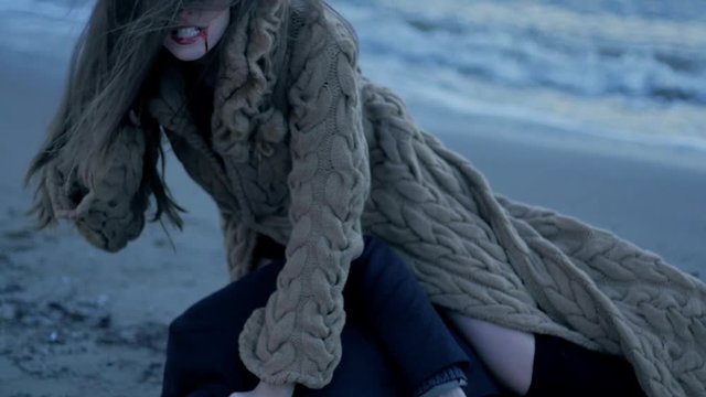 Beautiful female vampire satisfied after killing man