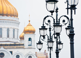 Fototapeta na wymiar Lanterns and fragment of the Cathedral of Christ the Savior. Winter. Moscow. Russia