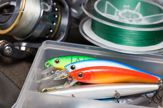 Closeup of a fishing box with colorful lures.
