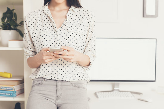 Young Beautiful Businesswoman Texting