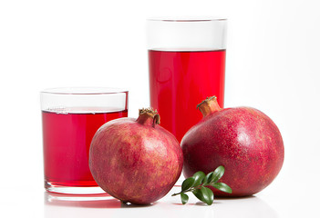 Red pomegranate juice with seeds on the white background.