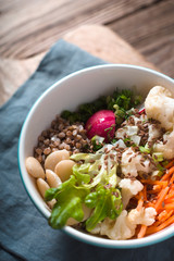 Vegetable salad with buckwheat in a ceramic bowl