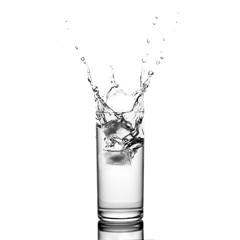 water splash in glass isolated on white background
