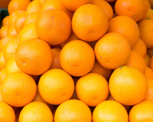 bunch of fresh juicy oranges on the market
