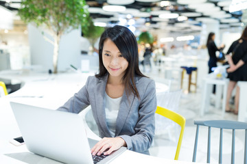 Businesswoman working on notebook computer