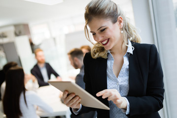 Professional beautiful businesswoman holding tablet