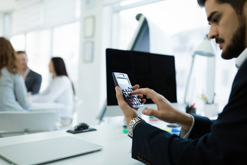 Accountant checking statistics of company