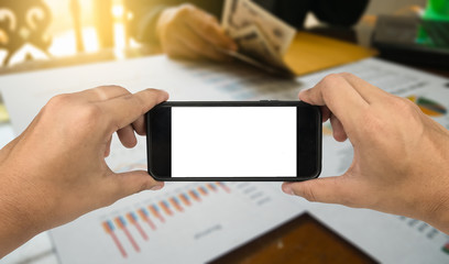 hand hold phone with Statement paper in financial concept.