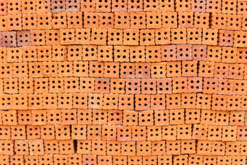 Orange brick laid in a row a lot.