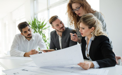 Business colleagues working in office