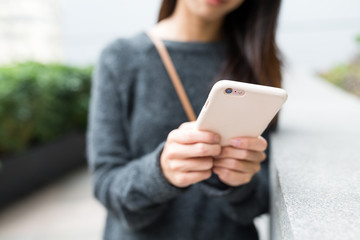 Woman use of mobile phone at outdoor