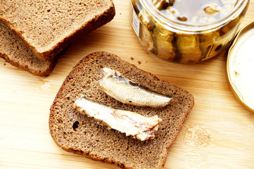 Fish sprats canned food in a glass jar