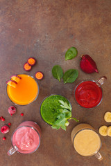 Fresh detox smoothies prepared with various fruits and vegetable ingredients