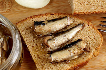Fish sprats canned food in a glass jar