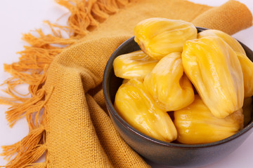 Tropical fruit Jackfruit (jakfruit, jack, jak) in bowl on white background. Selective focus © jantima