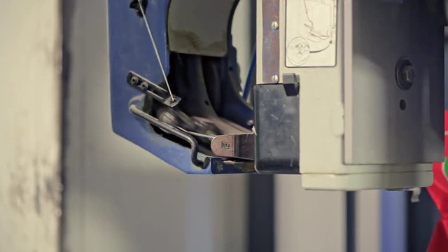 Packing for animal feed in bags man at the factory for the production of animal feed