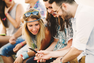 Party people taking selfies during summer festival