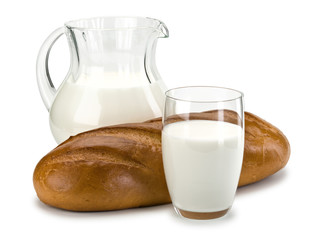 Glassware filled with milk and a white loaf long loaf