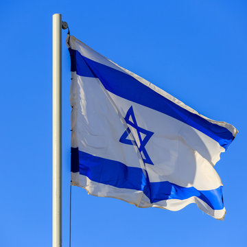 Flag of Israel on sunrise