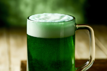 jar with dyed green beer