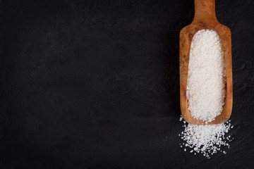 Granulated cassava (tapioca) on black background