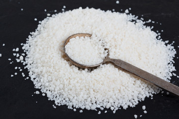 Granulated cassava (tapioca) on black background