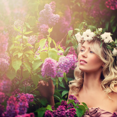 Fototapeta premium Healthy Woman in Flowers Wreath Outdoors. Spring and Aromatherapy Concept