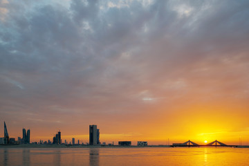 Fototapeta premium Bahrain skyline line and dramatic skyline during sunset
