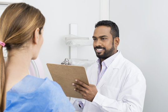 Doctor Talking To Patient Before Mammogram X-ray Test