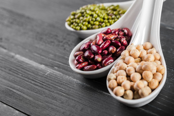 mix of beans on wooden table