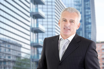 Fototapeta premium Closeup Of Happy Mature Businessman Smiling Outdoor