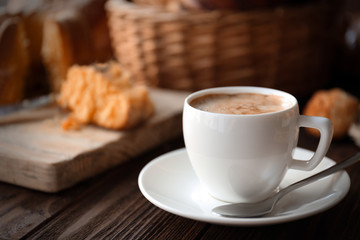 Cup of coffee and different bakery products