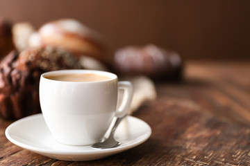 Cup of coffee and different bakery products