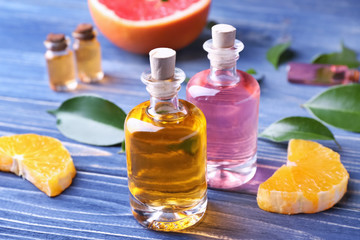 Aroma oil with citrus on color background