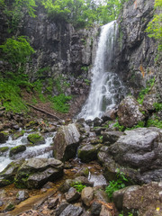 Big waterfall in green stone