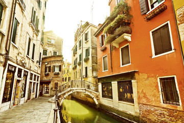 View of the colorful Venetian houses with bridges across on the canal in Venice