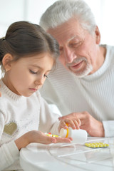 Granddaughter takes care of a sick grandfather