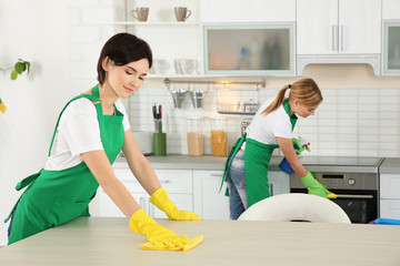 Housekeeping team cleaning kitchen