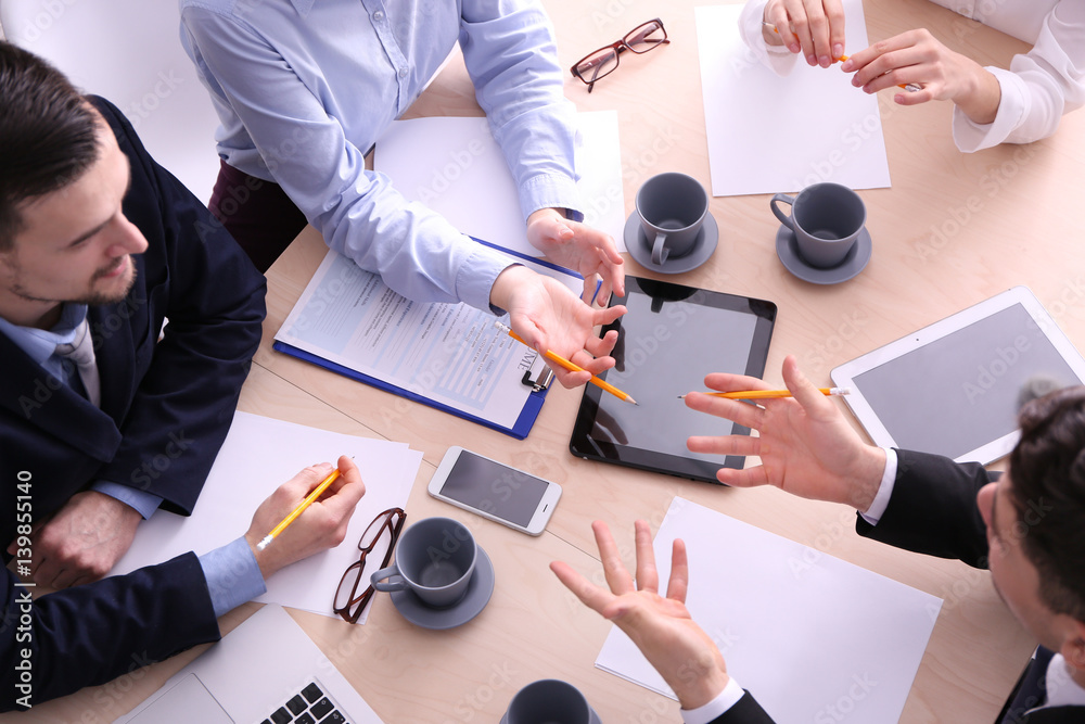 Wall mural Job interview at table in modern office