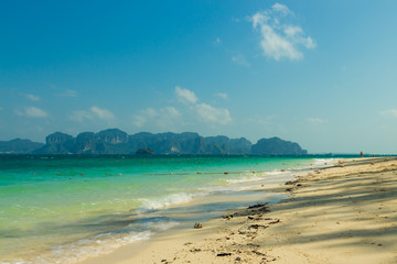 Clear water and blue sky, Poda island beach in Krabi province, Thailand.