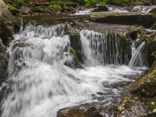 Big waterfall in green stone