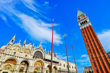 View of Saint Mark's Basilica and St Mark's Campanile on the St Mark's Square in a sunny day in Venice.