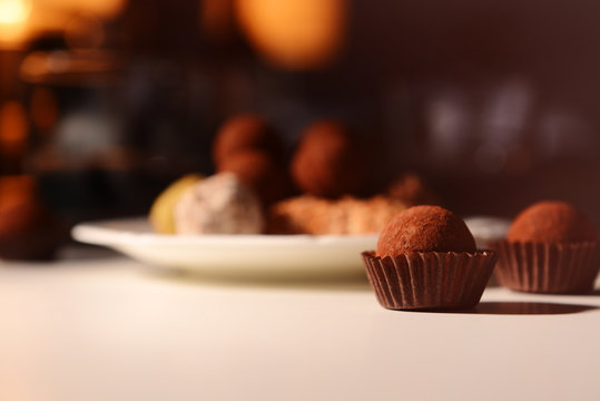 Chocolate truffles on white table