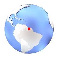 Suriname on metallic globe isolated