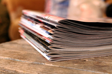 Magazines on the wooden table 