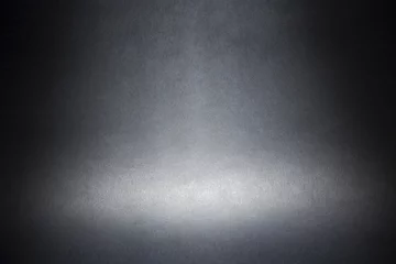 Abwaschbare Fototapete Licht und Schatten Scheinwerfer auf einem grauen materiellen abstrakten Hintergrund