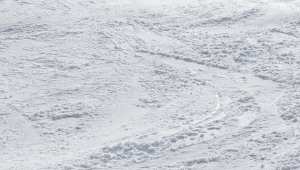 close up of a snowy background with ski trails