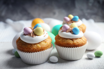 Decorated Easter cupcakes on linen tablecloth