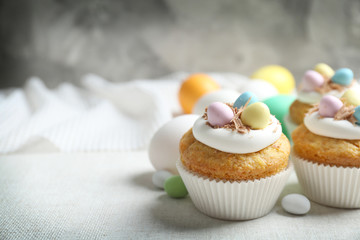 Decorated Easter cupcakes on linen tablecloth