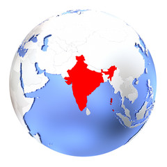 India on metallic globe isolated